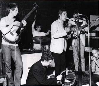 22 July 1964, as the High Numbers at the Scene Club, John with early Marshall 4×12 and sunburst Epiphone Rivoli semi-acoustic bass.