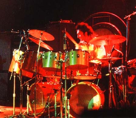 Gold-colored kit featuring outer row of single-headed (concert) toms.
