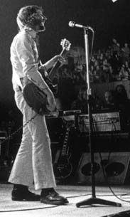 Ca. December 1971, view of stage-right floor wedge. Bobby Pridden looks on from the stage-right mixing board.