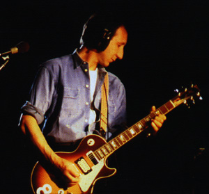 Ca. 1985, in the studio for White City sessions, with cherry sunburst, #8, with prototype-era black surround of the middle-position pickup.