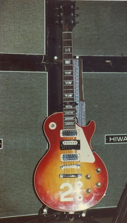 Ca. 1978, at the Who Exhibition in London, cherry sunburst, #2 three-pickup model, with prototype-era black surround of the two-tone middle-position pickup.